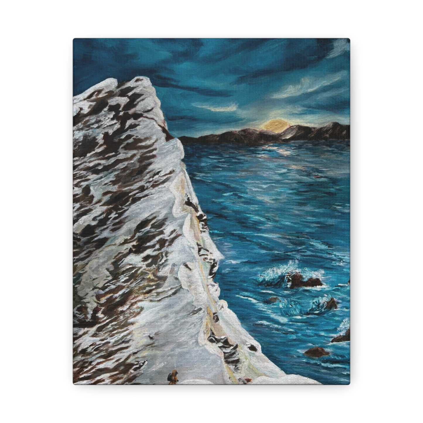 Snowy mountain overlooking the ocean