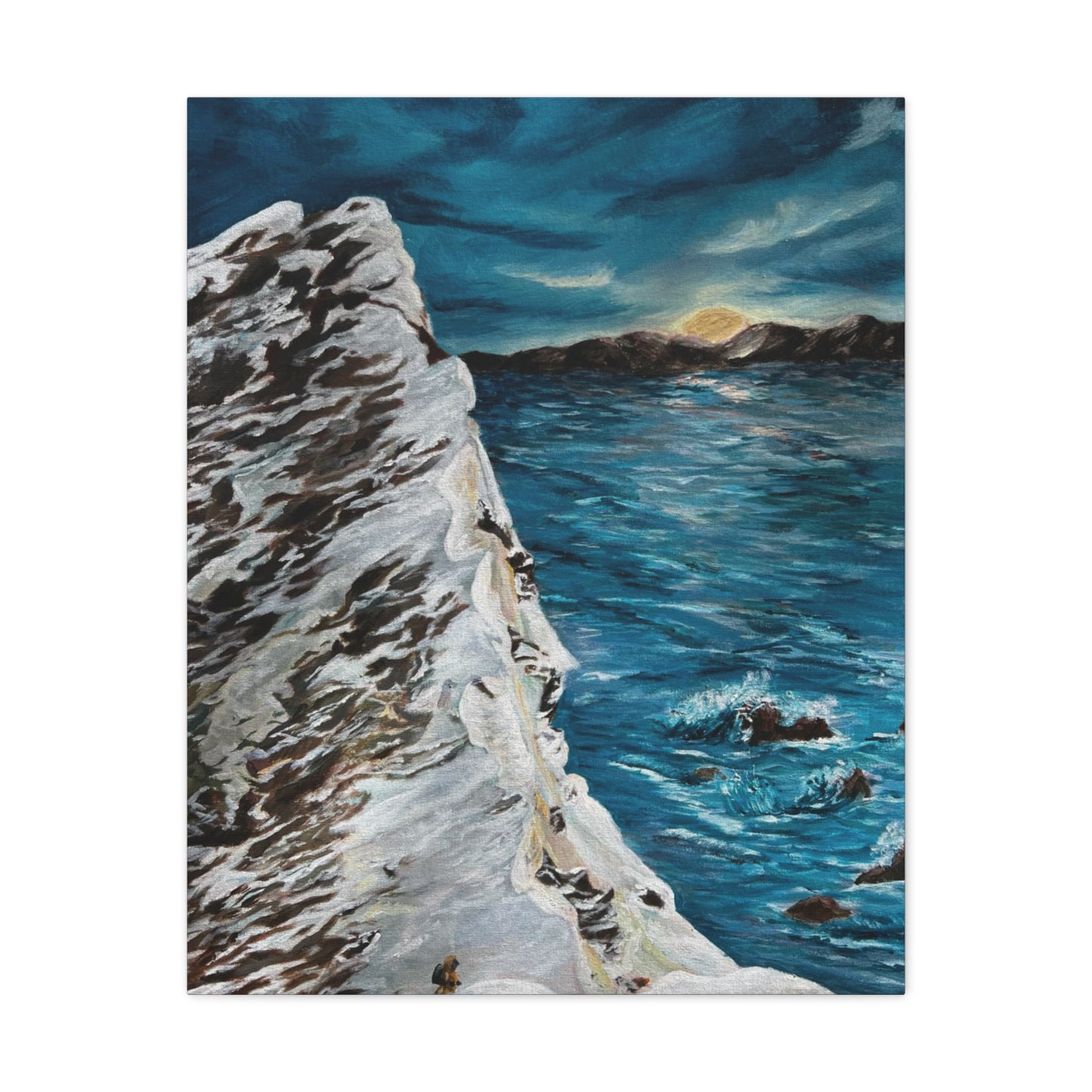 Snowy mountain overlooking the ocean